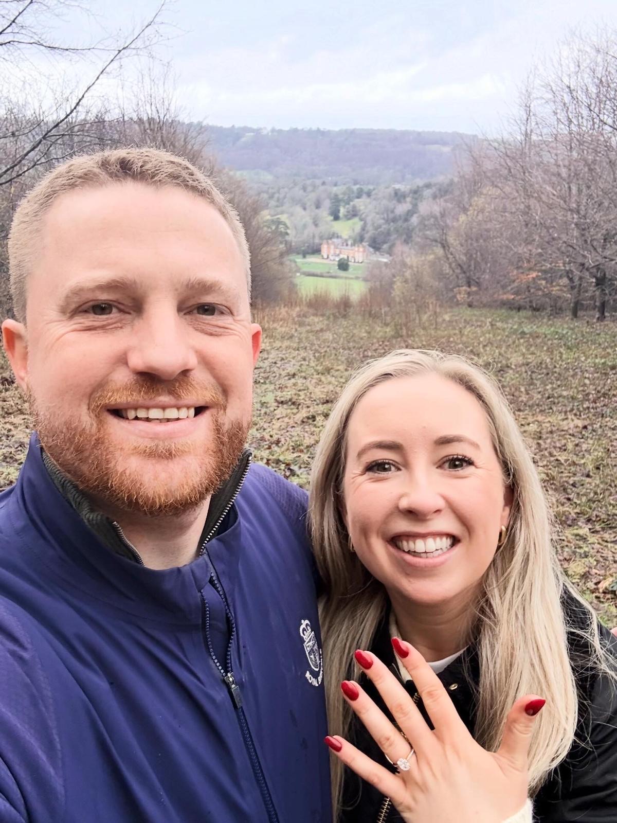 Zara showing off her engagement ring on a countryside walk